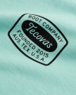 Closeup detail view of Men's Boot Company Tee - Teal / Black