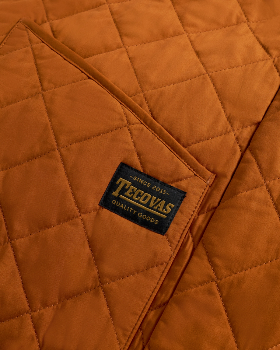 Closeup view of Men's Ranch Coat - Ivory / Saddle