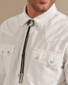 Closeup of man wearing a bolo tie in a photo studio