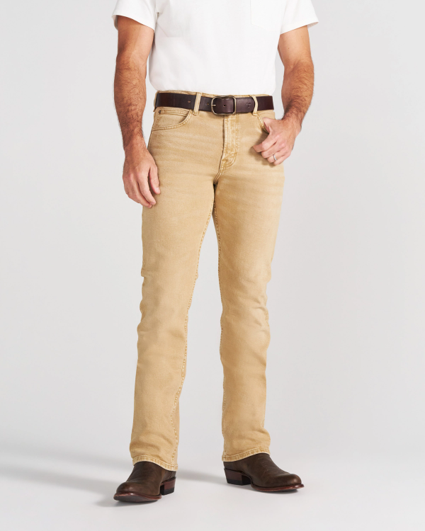 A person wearing a white t-shirt, tan jeans, a brown leather belt, and brown cowboy boots.