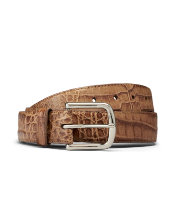 Brown leather belt with a crocodile pattern and a silver rectangular buckle, coiled on a plain white background.