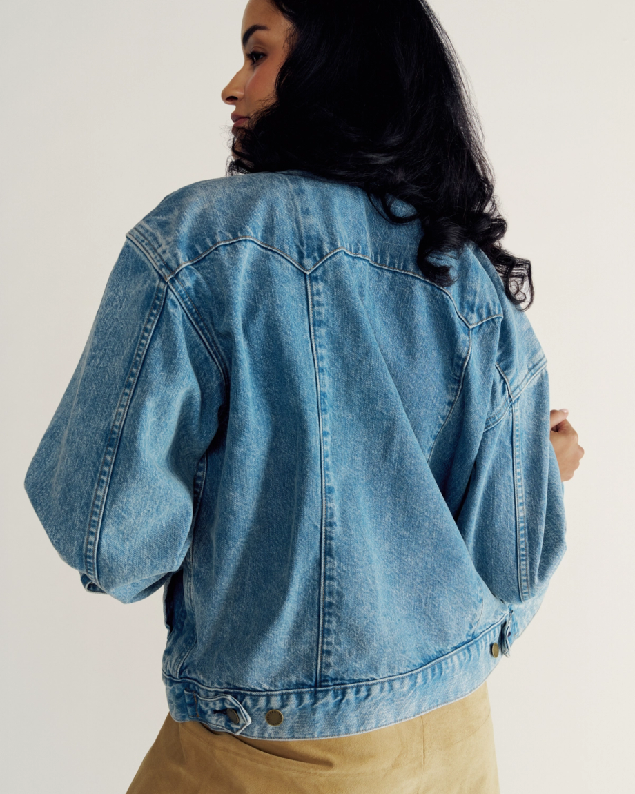 Back view of Women's Denim Trucker Jacket - Medium Wash on model