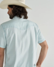 Closeup detail view of Men's Denim Short Sleeve Pearl Snap - Ultra Light