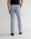 Back view of Men's Slim Straight Heritage Denim - Light Blue on model