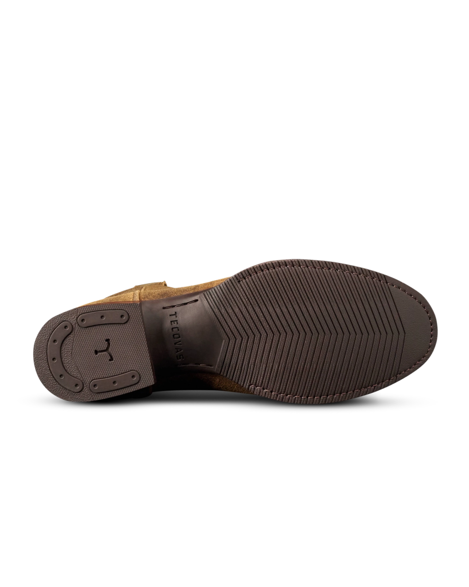 Bottom view of The Glen Roughout dress shoe in Dustwood, featuring a textured rubber sole with branding and a durable rubber heel for added traction.