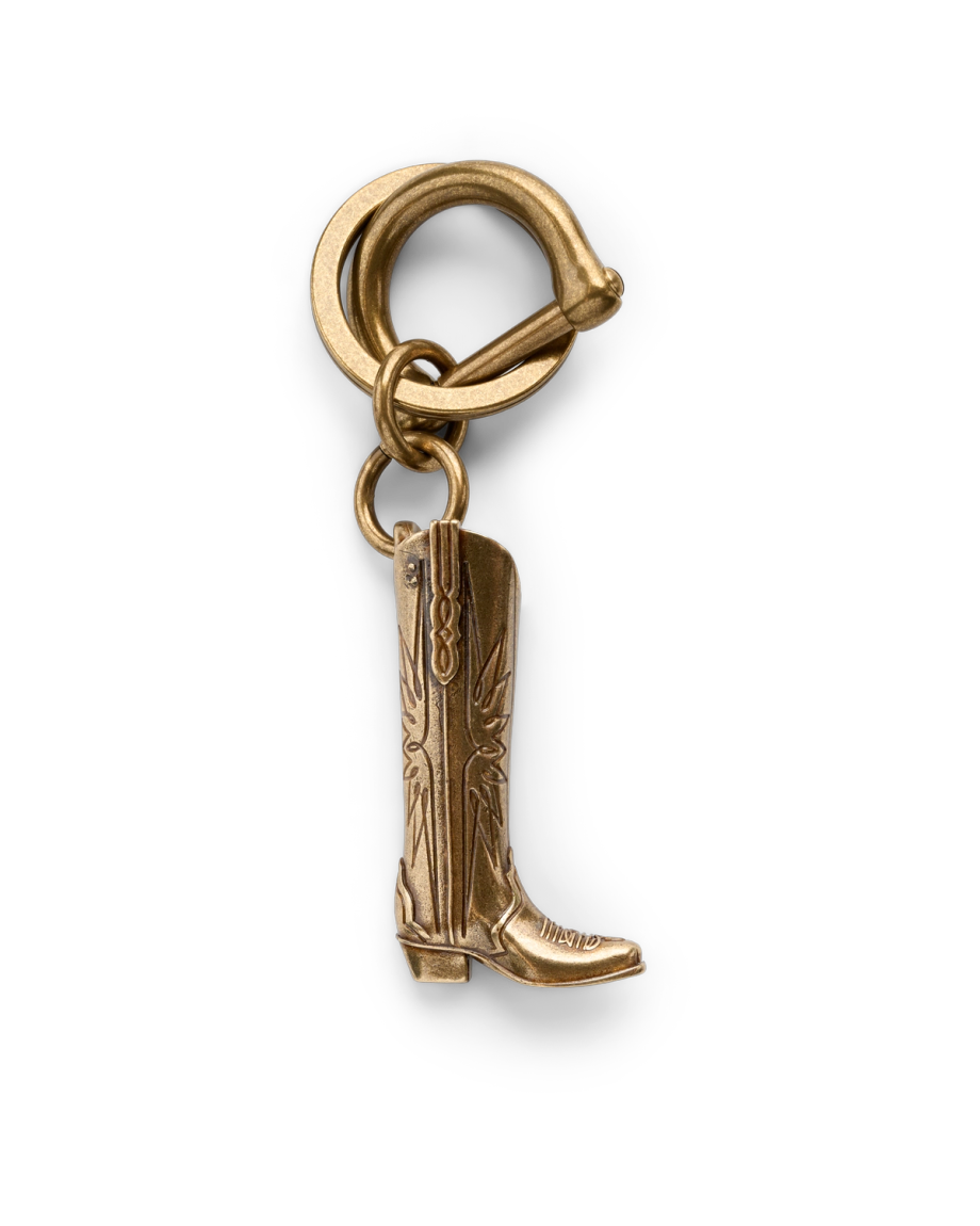 Front view of Loretta Boot Charm - Antique Brass on plain background