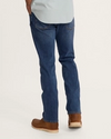 Back view of Men's Rugged Standard Jeans - Medium on plain background