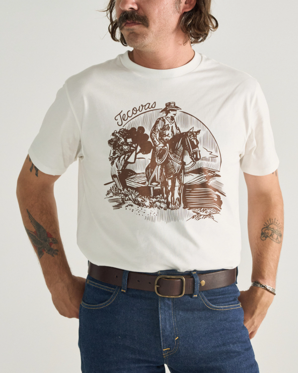 Front view of Men's Sketchbook Cowboy Tee - Bone / Brown on model