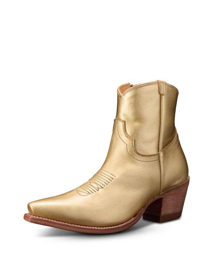 A shiny gold cowboy boot with a pointed toe and brown wooden heel, featuring decorative stitching on the upper.