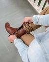 close up of Dean Bourbon Brown cowboy boots on a man's feet 