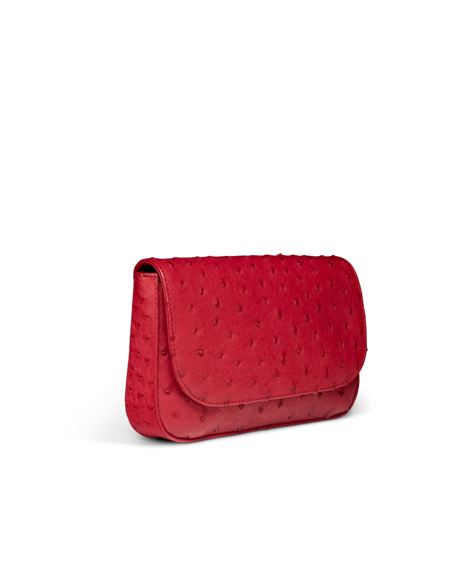 Quarterfront view of Ostrich Flap Shoulder Bag - Barn Red on plain background