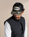 Profile view of Genuine Tecovas Patch 6 Panel Mid Profile Hat - Black/Camo on plain background