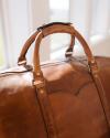 Close up lifestyle image of the Bartlett Large Weekender in Cognac