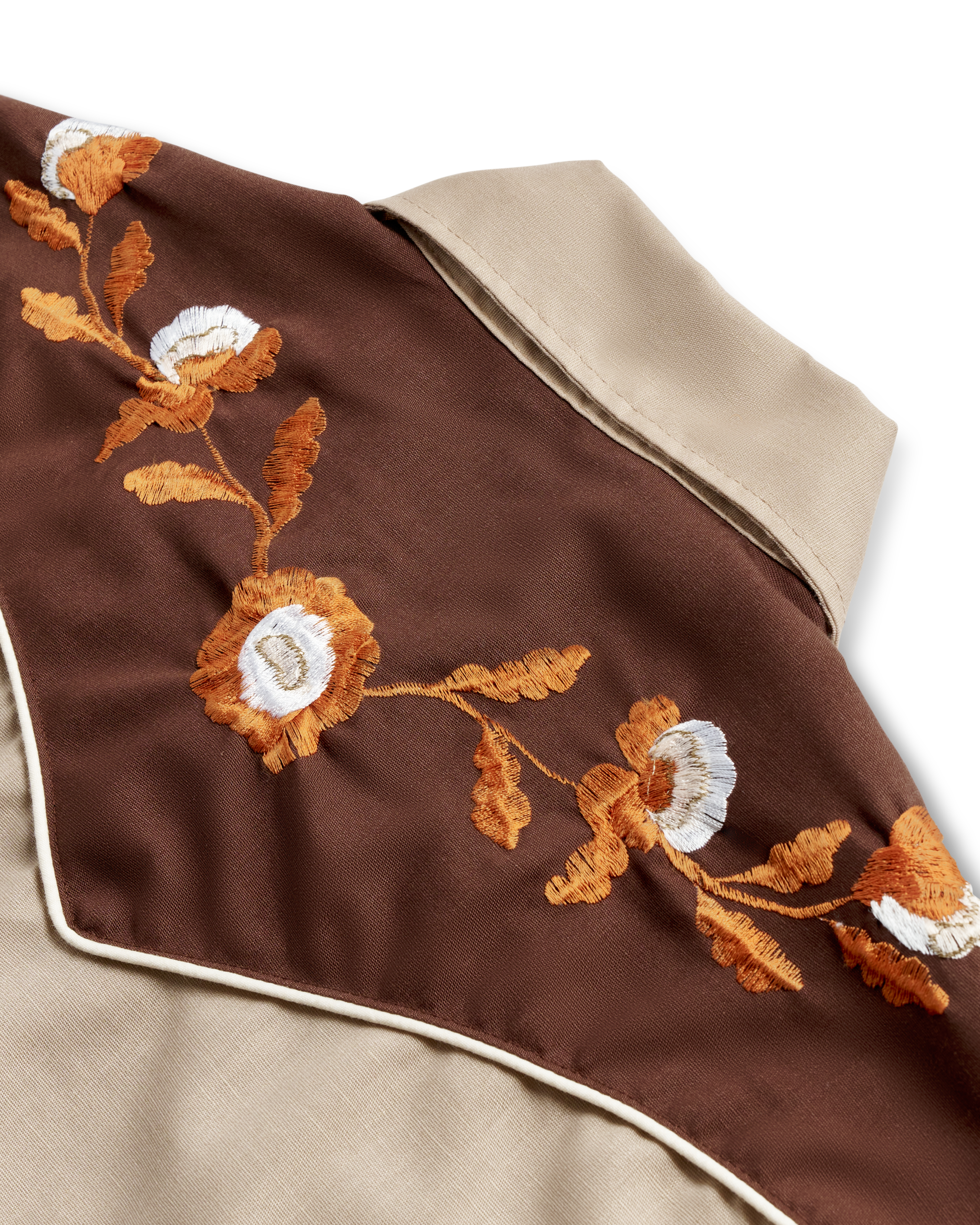 Closeup detail view of Tecovas x Cathy Hahn Men’s Vintage Western Pearl Snap - Tan / Chocolate