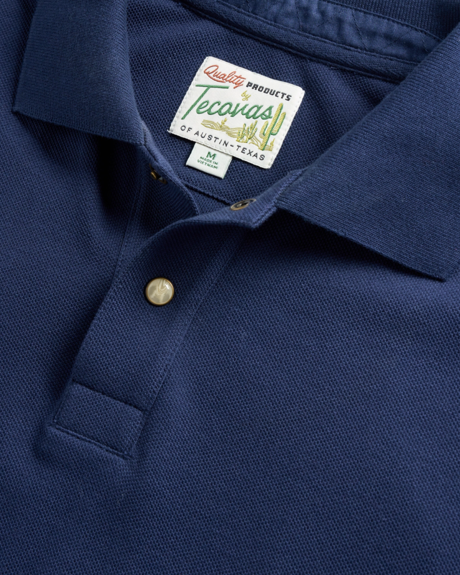Closeup detail view of Men's Polo Pearl Snap SS - Navy