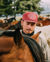 Profile view of Vintage Rope Five-Panel High Profile Trucker - Crimson on plain background