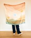 Kelly Colchin holding the limited edition Mother's Day Scarf she designed for Tecovas.