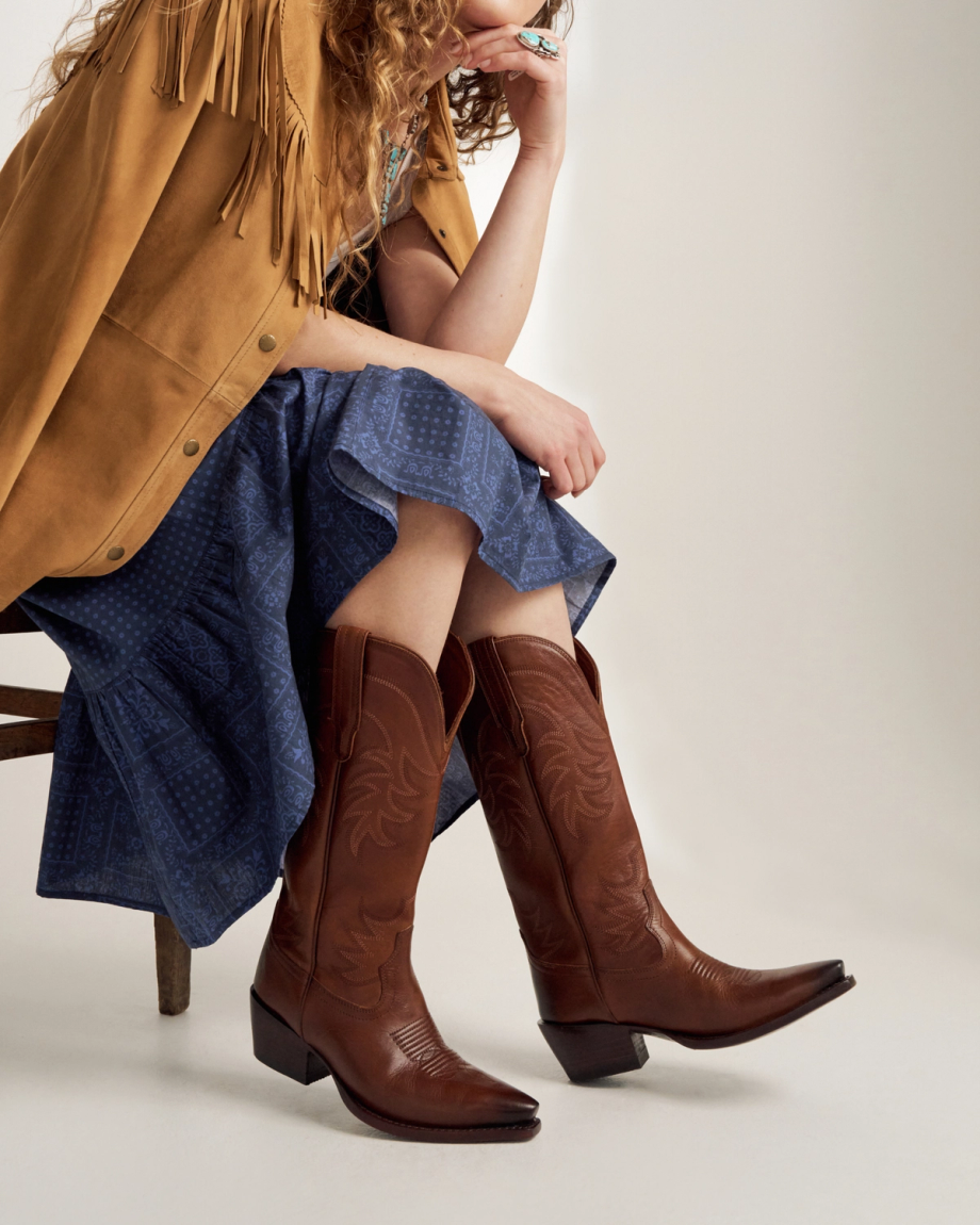 Closeup of woman in a photo studio sitting and wearing The Annie in Sequoia