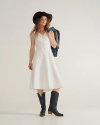 Full view of Women's Eyelet Linen Midi Dress - White on model