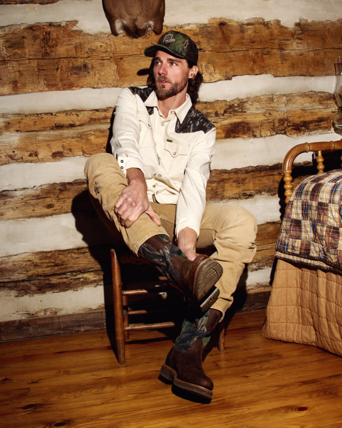 Full view of Tecovas x Mossy Oak Rugged Roper - Full Foliage Cowhide on plain background