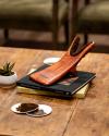 Boot jack sitting on table with books