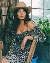 cowboy boots, barn and a dress