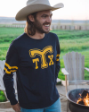Man wearing a cowboy hat and a long sleeve Tecovs varisty tee shirt.