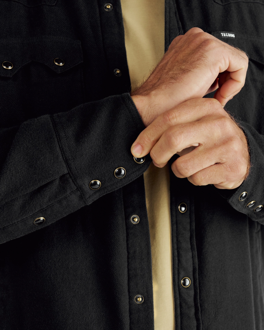 Closeup detail view of Men's Sawtooth Pearl Snap Shacket - Black