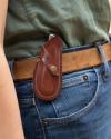 Pocket knife strapped to a belt 