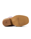 The sole of a boot with "Tecovas" stamped on the bottom; heel features a horseshoe-shaped detail.
