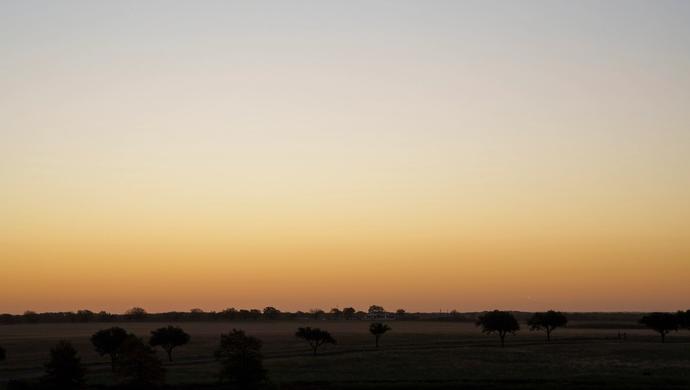 Skyline at sunset over a river