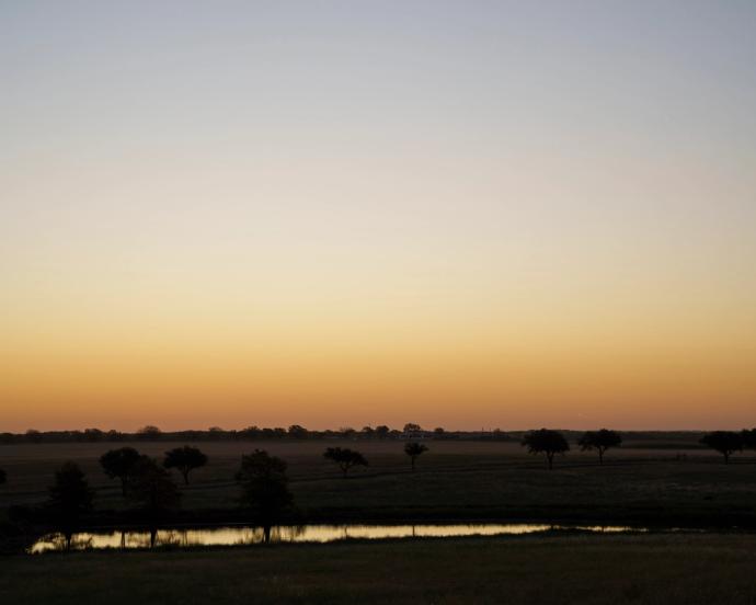 Skyline at sunset over a river