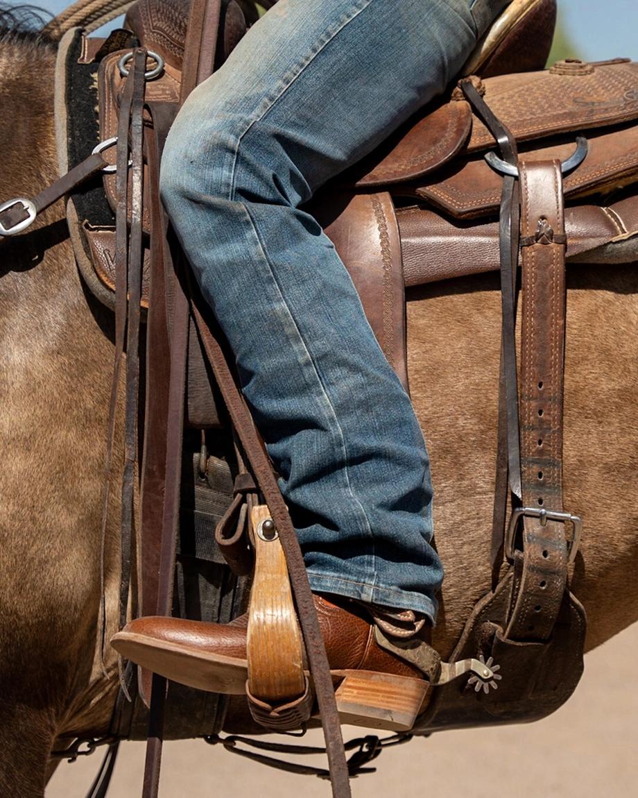 Man wearing The Prescott Hickory Horseman boots on a horse