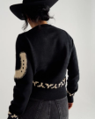 Back view of Women's Crew Neck Lucky Boots Sweater - Black on model
