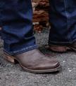 Man wearing the Chocolate Relic Lizard Lankford cowboy boots