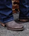 Man wearing the Chocolate Relic Lizard Lankford cowboy boots