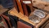 Several Tecovas wallets sitting on a table.