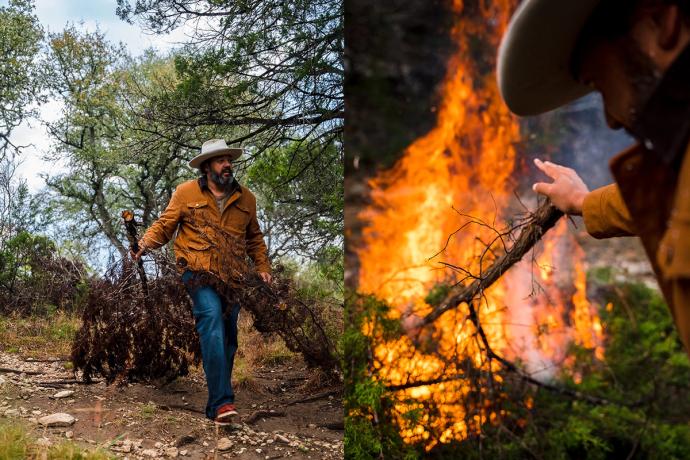 man pulling a branch and throwing it into a bonfire