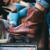 Image of roper boot at a shoe shine station