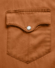 Closeup detail view of Men's Denim Long Sleeve Pearl Snap - Rust