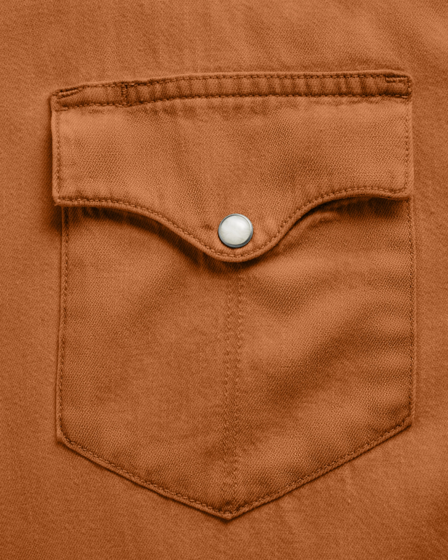 Closeup detail view of Men's Denim Long Sleeve Pearl Snap - Rust