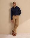 Man wearing navy cotton button down shirt with pearl snaps