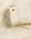 Closeup view of Men's Ranch Coat - Ivory / Saddle