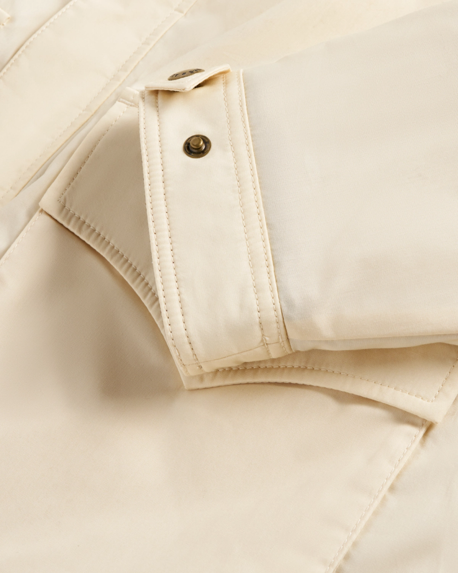 Closeup view of Men's Ranch Coat - Ivory / Saddle