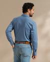 Back view of man wearing the easywear pearl snap in blue fin