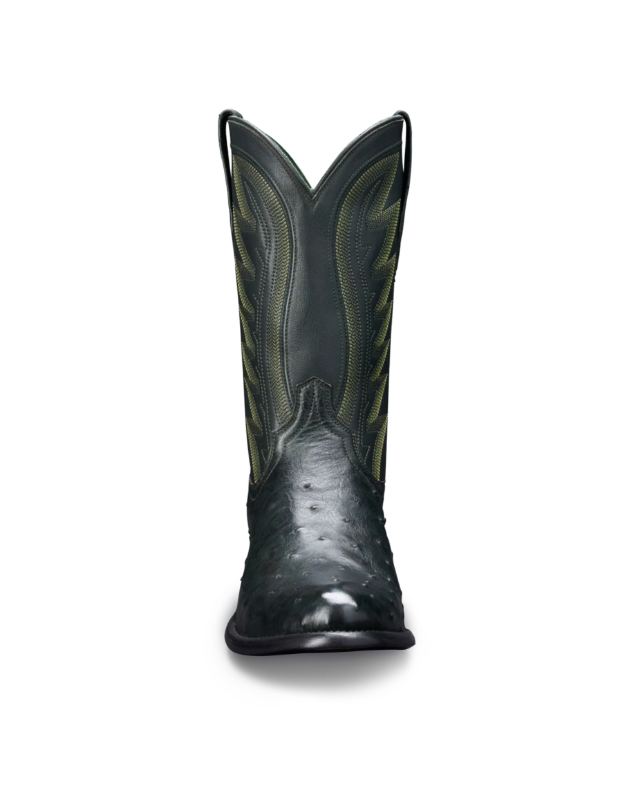 Front view of a single, dark green cowboy boot with intricate stitching on the shaft.
