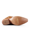Sole view of The Annie - Pecan / Bone Cowhide on plain background