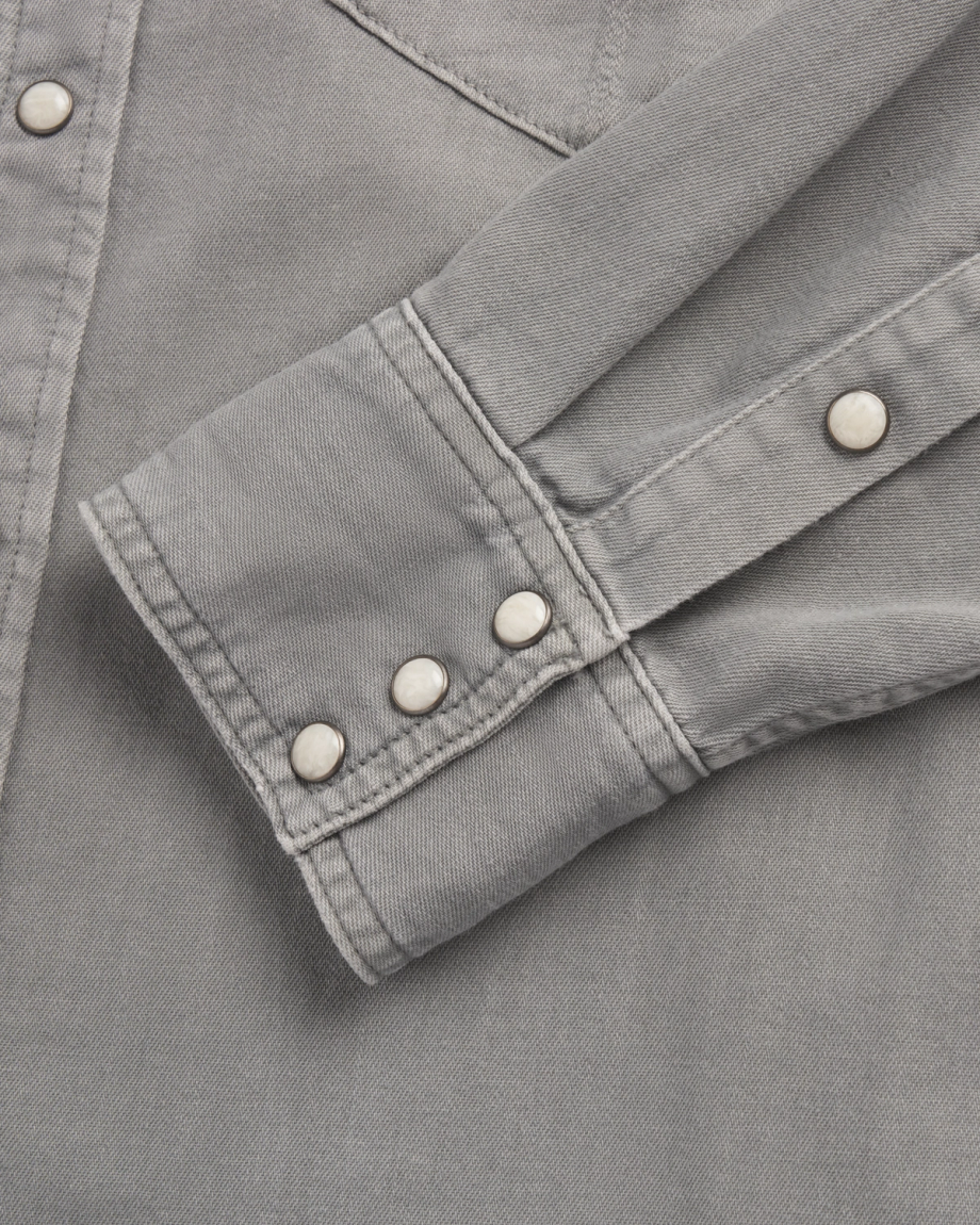 Closeup detail view of Men's Denim Pearl Snap - Light Gray