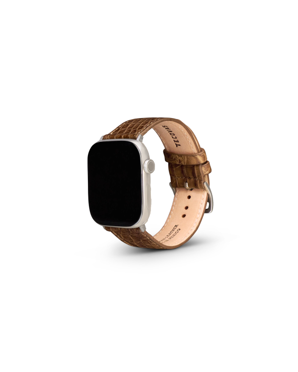 A smartwatch with a silver case and a brown leather textured strap, displayed on a plain white background.