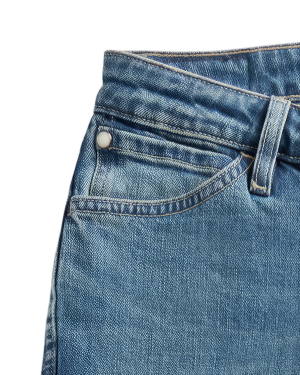 Closeup view of Women's Mid-Rise Slim Flare - Medium Wash